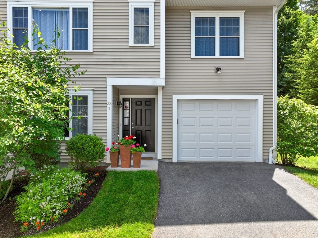 38 Webster Street, Unit 1 Needham, MA 02494 - Photo 2 of 35 a view of a house with a yard and plants
