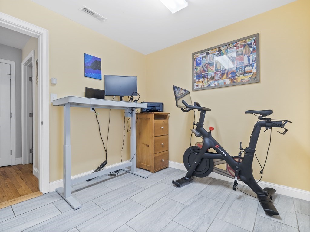 38 Webster Street, Unit 1 Needham, MA 02494 - Photo 23 of 35 a view of a room with gym equipment
