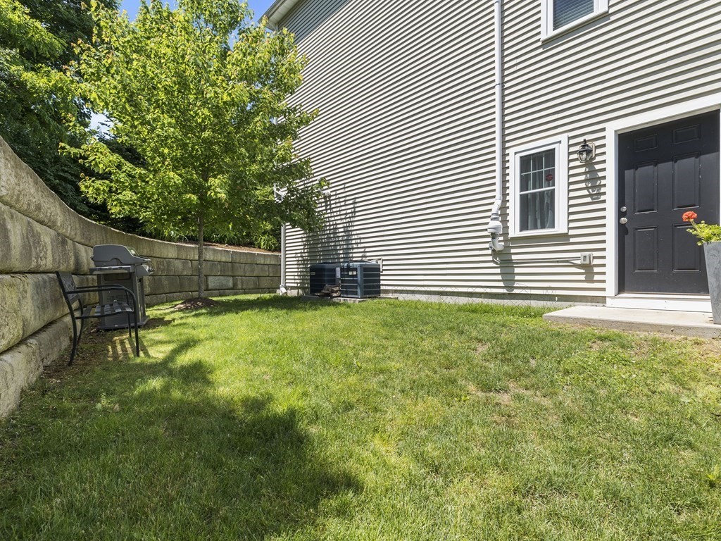 38 Webster Street, Unit 1 Needham, MA 02494 - Photo 25 of 35 a view of a backyard with a garden