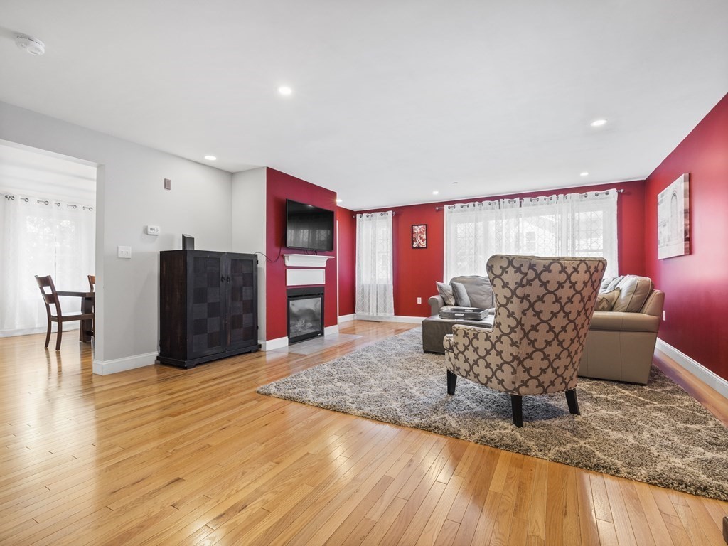 38 Webster Street, Unit 1 Needham, MA 02494 - Photo 3 of 35 a view of a livingroom with furniture and wooden floor