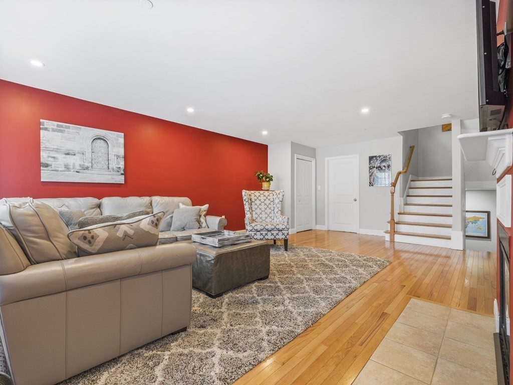 38 Webster Street, Unit 1 Needham, MA 02494 - Photo 5 of 35 a living room with furniture and a rug