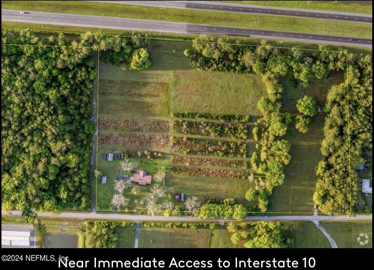 5464 George Hodges Road Macclenny, FL 32063 - Photo 8 of 23 a view of swimming pool from a window