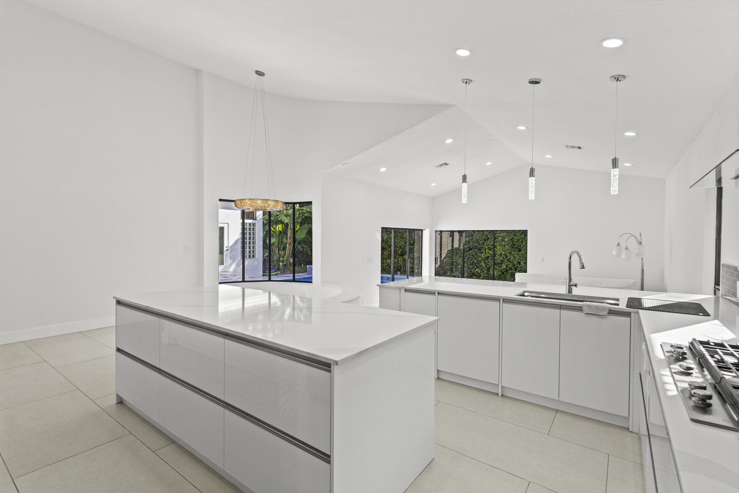 4798 Northwest 25th Way Boca Raton, FL 33434 - Photo 11 of 41 a large white kitchen with a large window