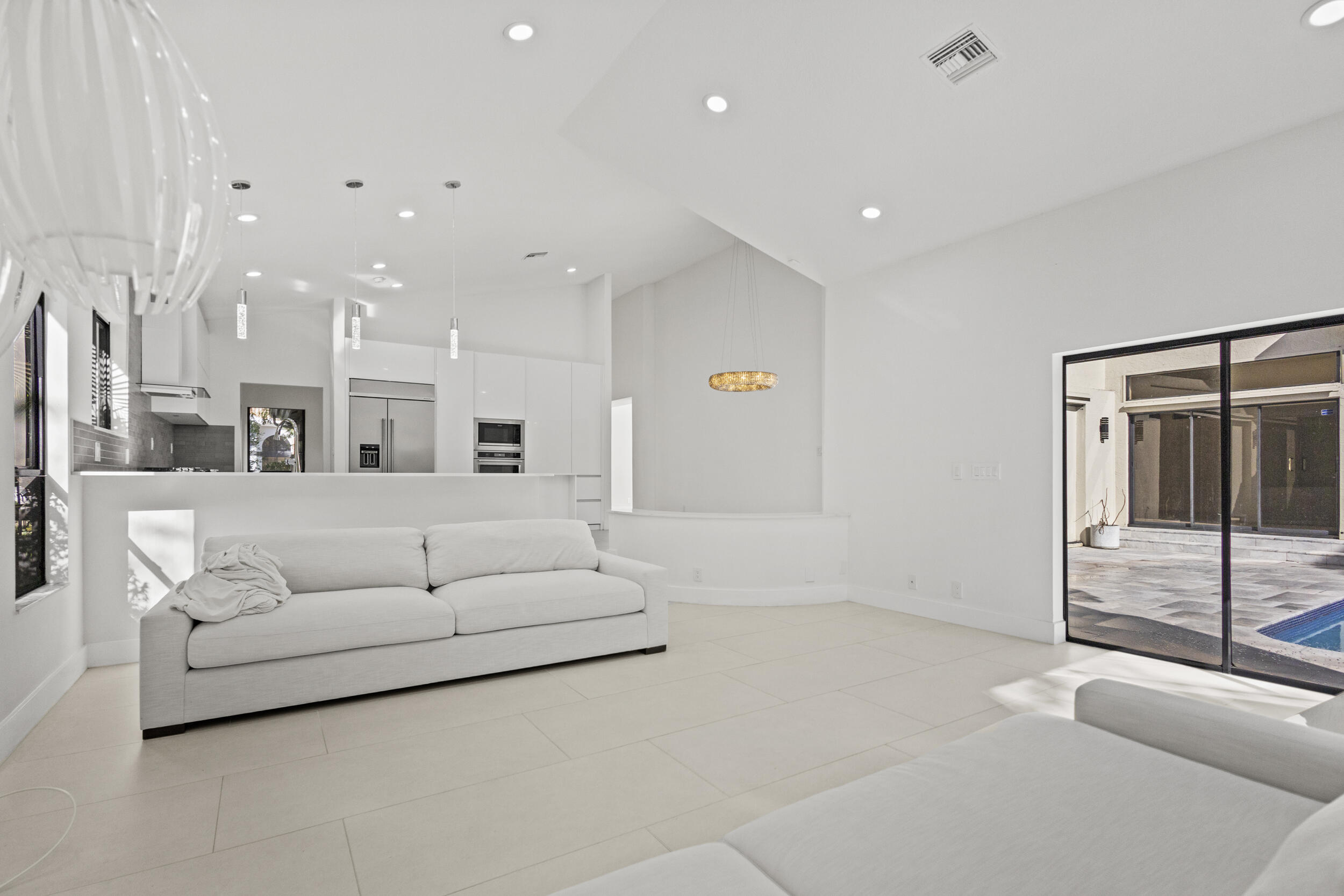 4798 Northwest 25th Way Boca Raton, FL 33434 - Photo 14 of 41 a living room with furniture and large mirror
