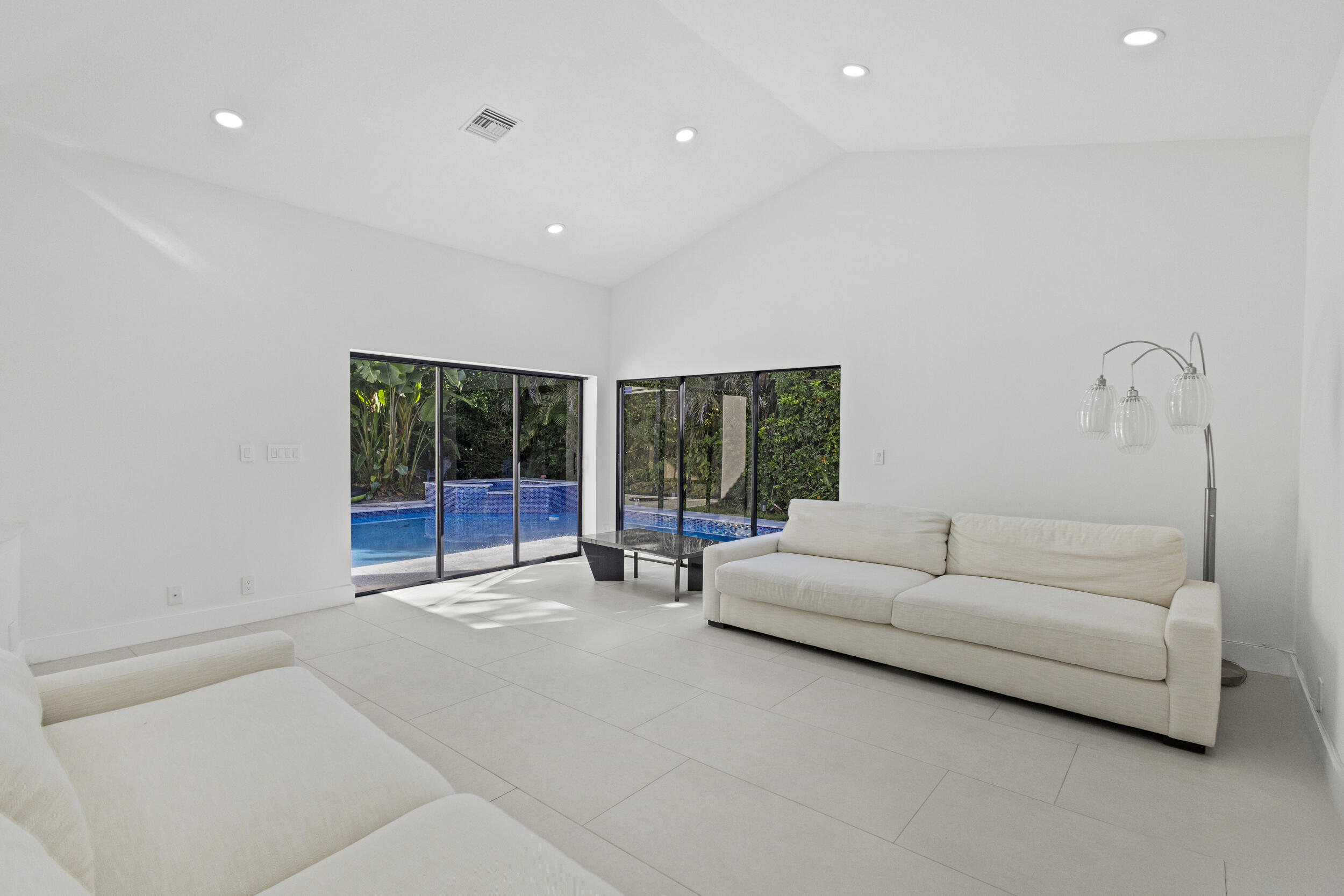 4798 Northwest 25th Way Boca Raton, FL 33434 - Photo 15 of 41 a living room with furniture and a large window