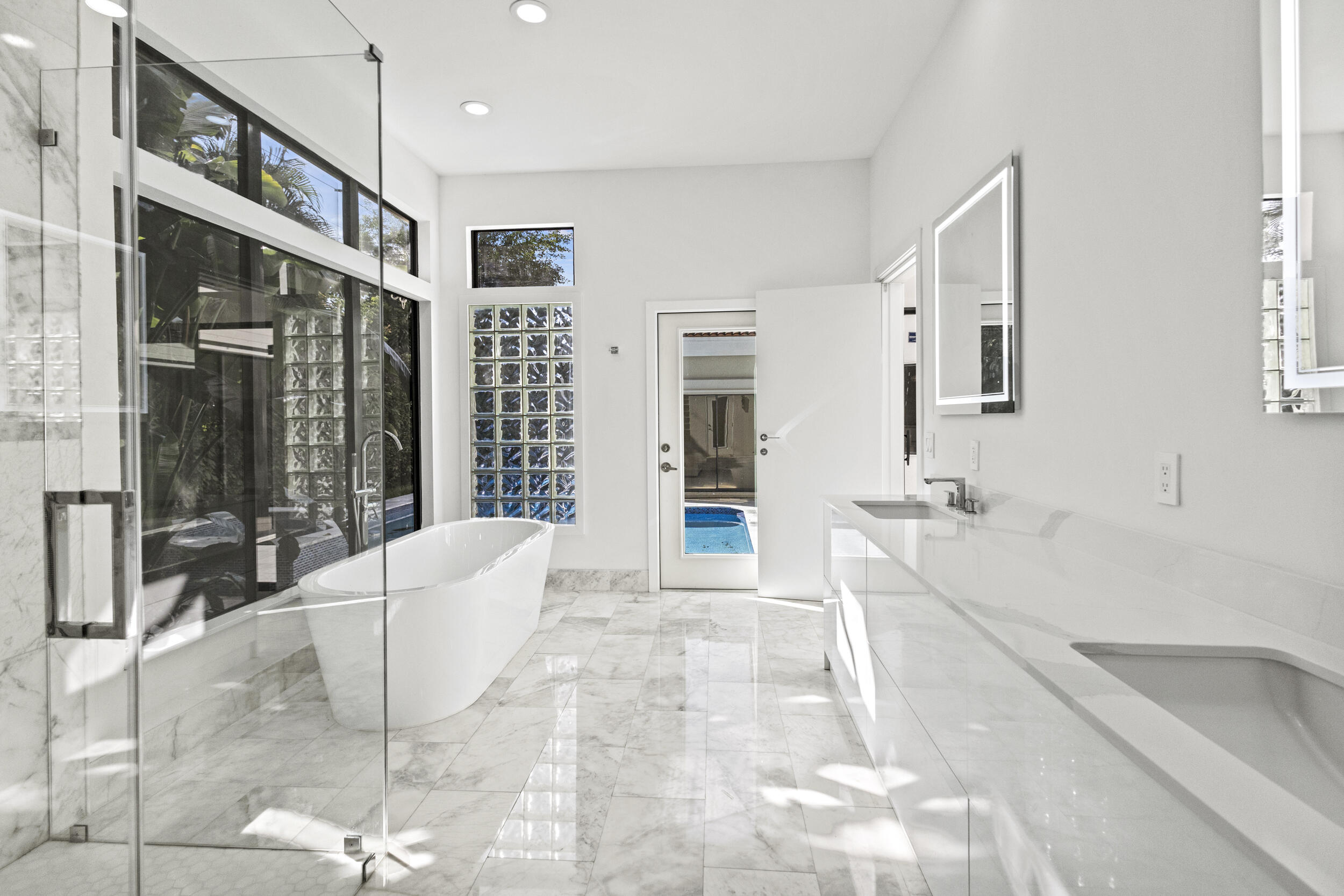 4798 Northwest 25th Way Boca Raton, FL 33434 - Photo 23 of 41 a spacious bathroom with a tub sink and mirror