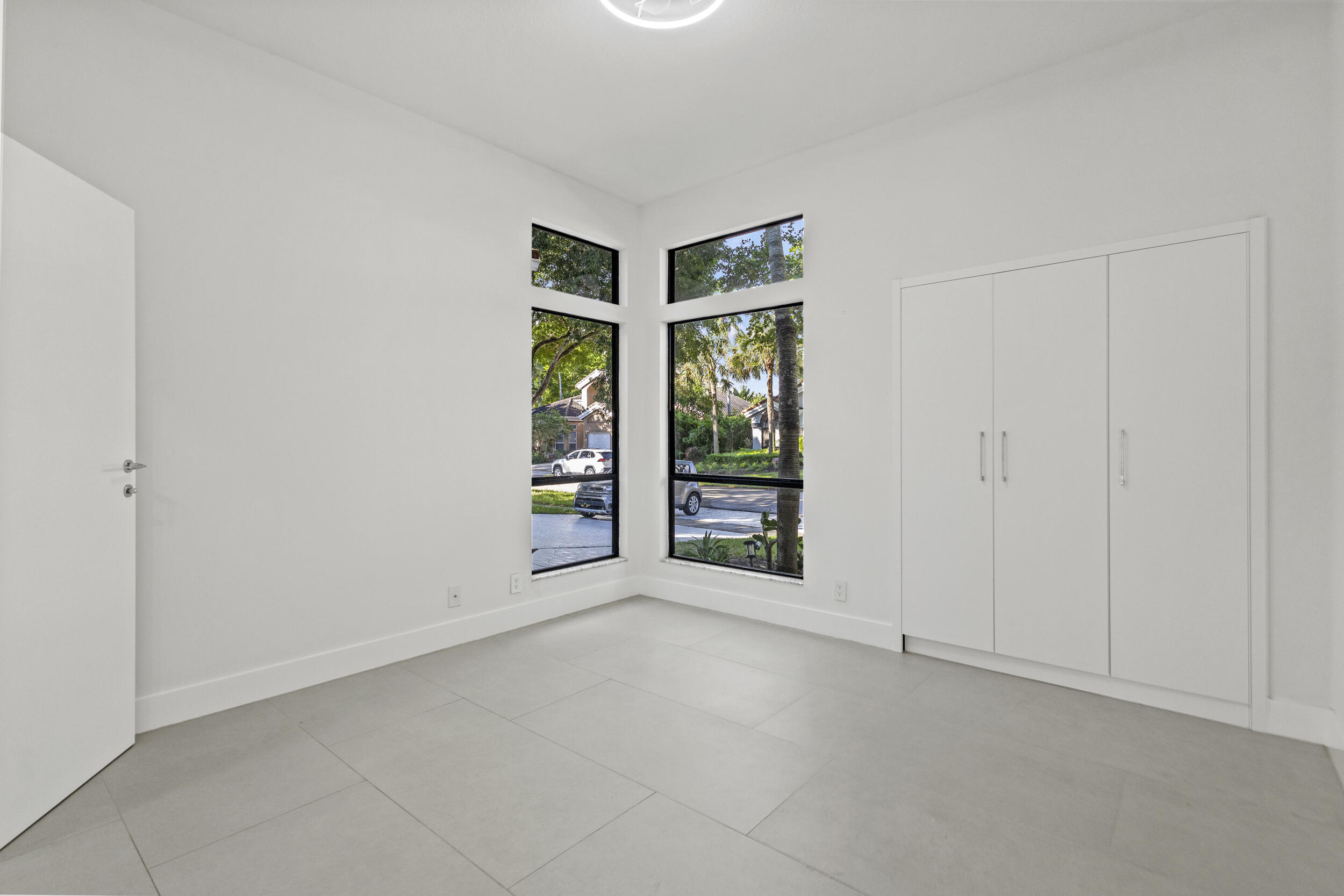 4798 Northwest 25th Way Boca Raton, FL 33434 - Photo 28 of 41 an empty room with windows