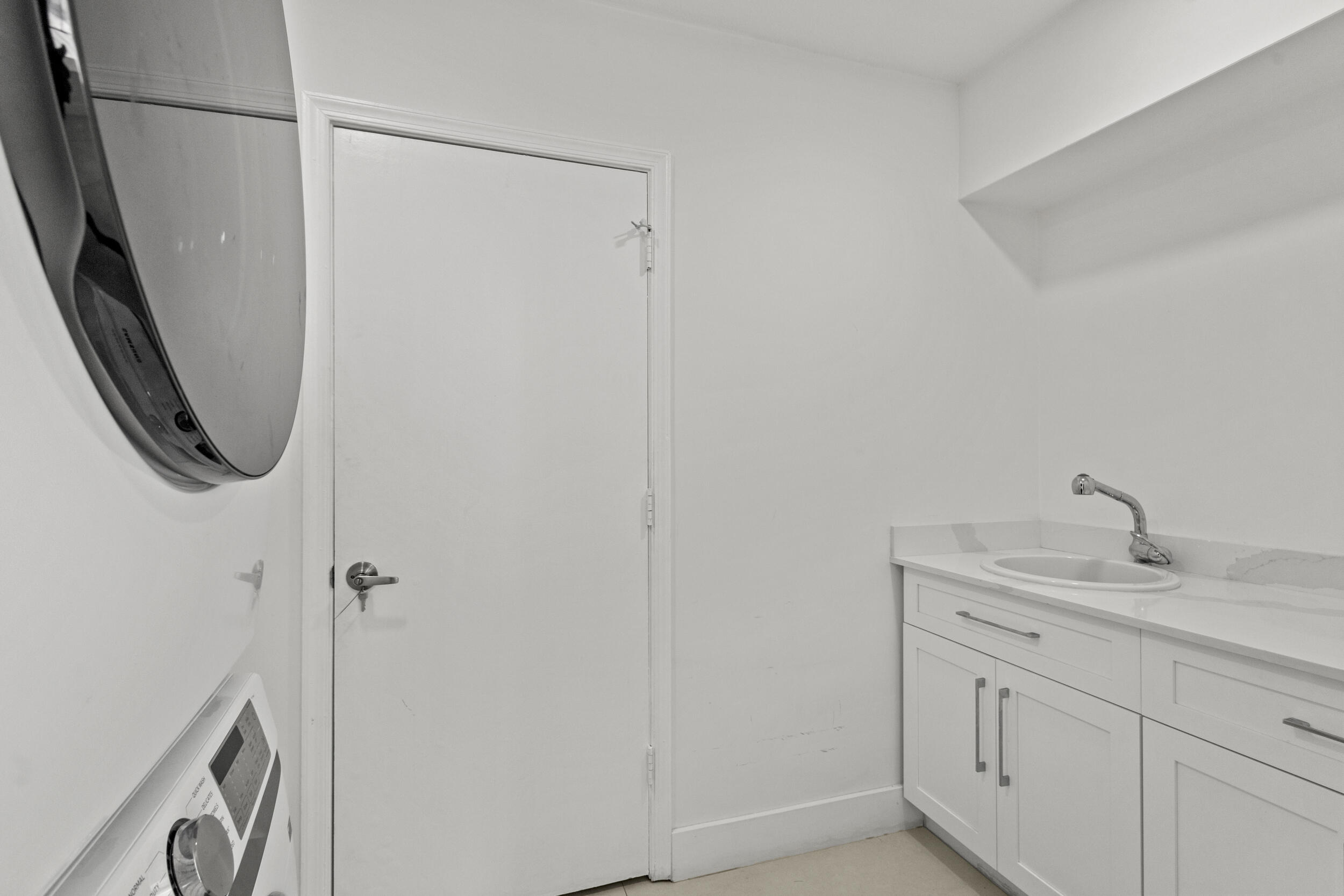 4798 Northwest 25th Way Boca Raton, FL 33434 - Photo 34 of 41 a bathroom with a granite countertop sink and a mirror
