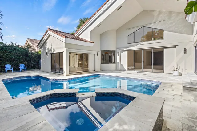 a view of a chairs and table in the patio