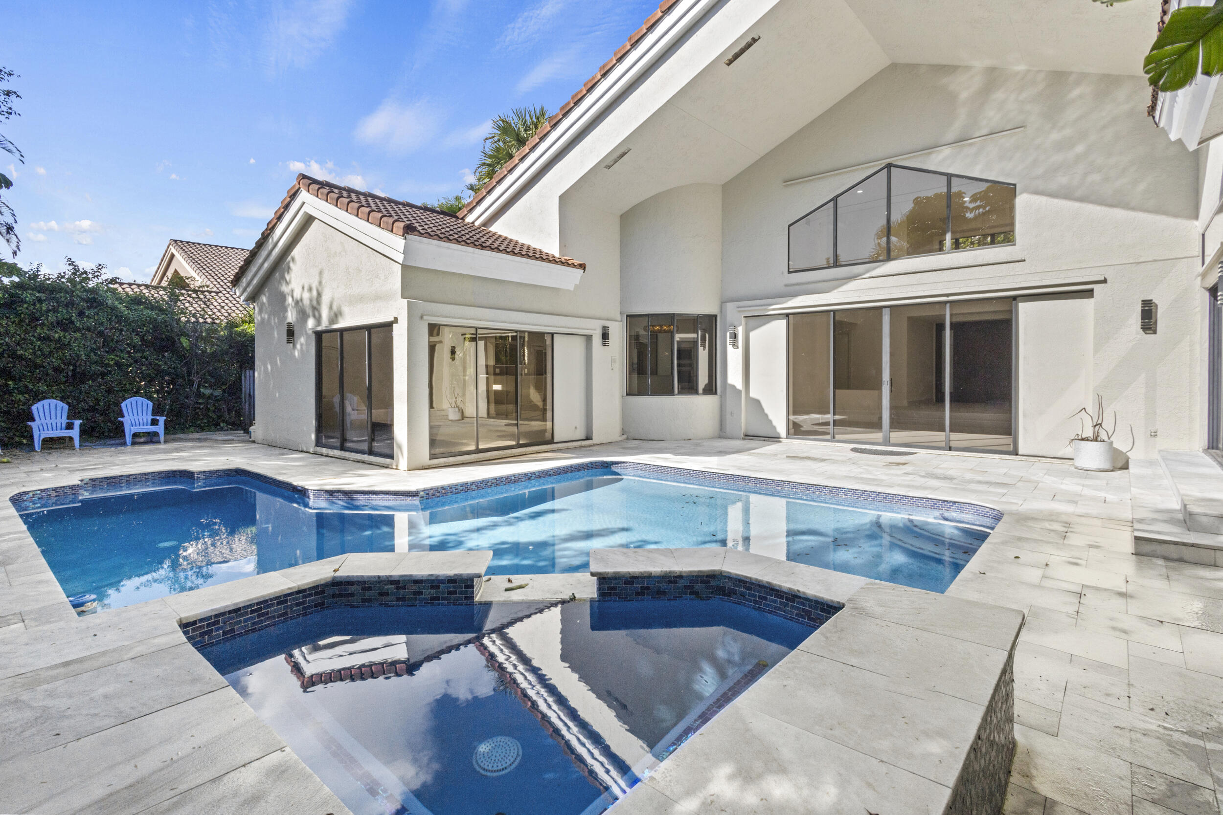 4798 Northwest 25th Way Boca Raton, FL 33434 - Photo 37 of 41 a view of a house with swimming pool and sitting area