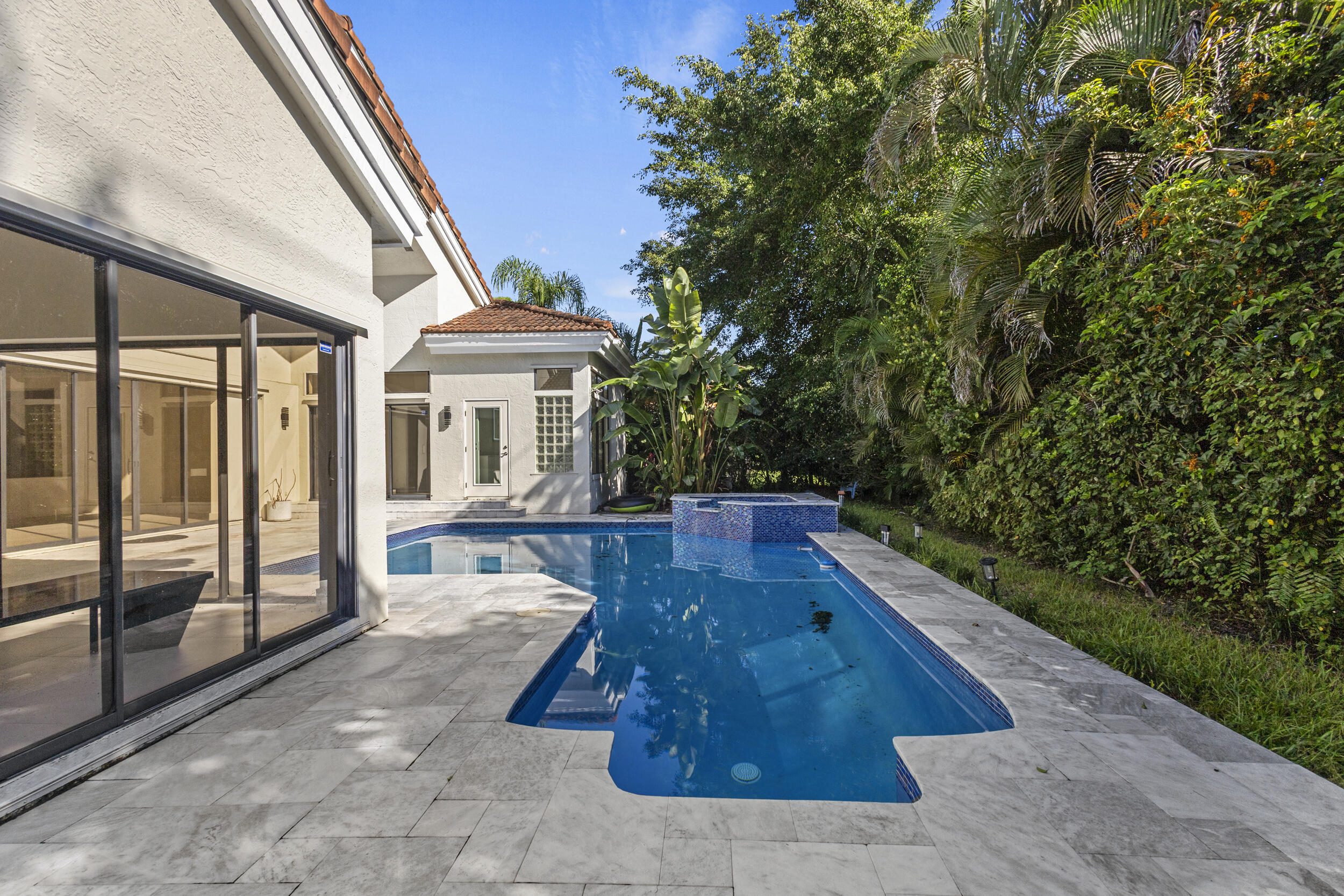 4798 Northwest 25th Way Boca Raton, FL 33434 - Photo 39 of 41 a view of house with a yard