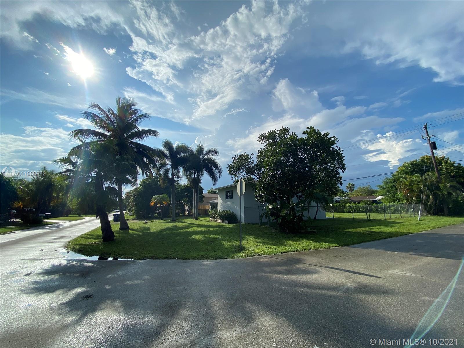1275 Northeast 204th Terrace Miami, FL 33179 - Photo 37 of 49 a green field with lots of trees