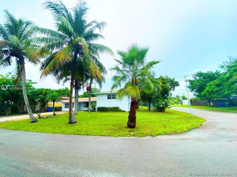 1275 Northeast 204th Terrace Miami, FL 33179 - Photo 4 of 49 a view of a backyard with a garden