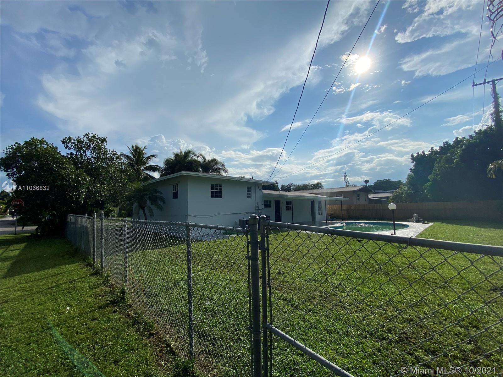 1275 Northeast 204th Terrace Miami, FL 33179 - Photo 42 of 49 a view of a backyard with sitting area