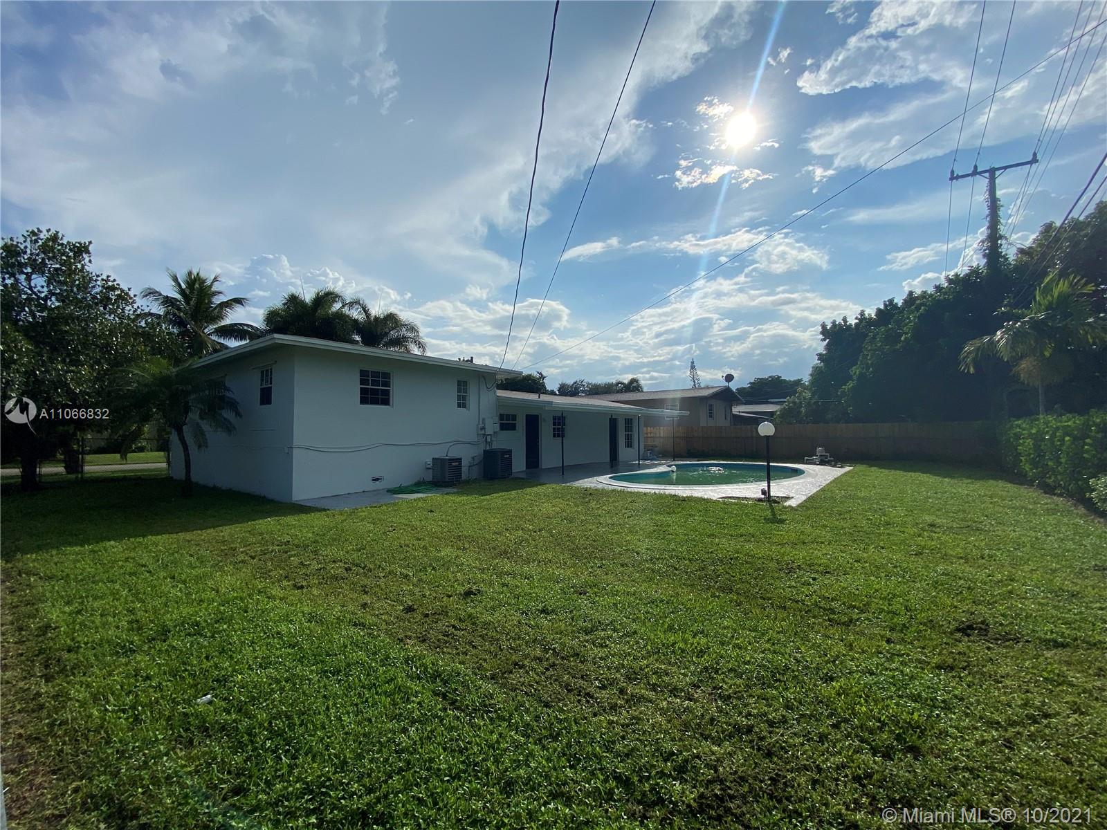 1275 Northeast 204th Terrace Miami, FL 33179 - Photo 46 of 49 a view of a house with a backyard