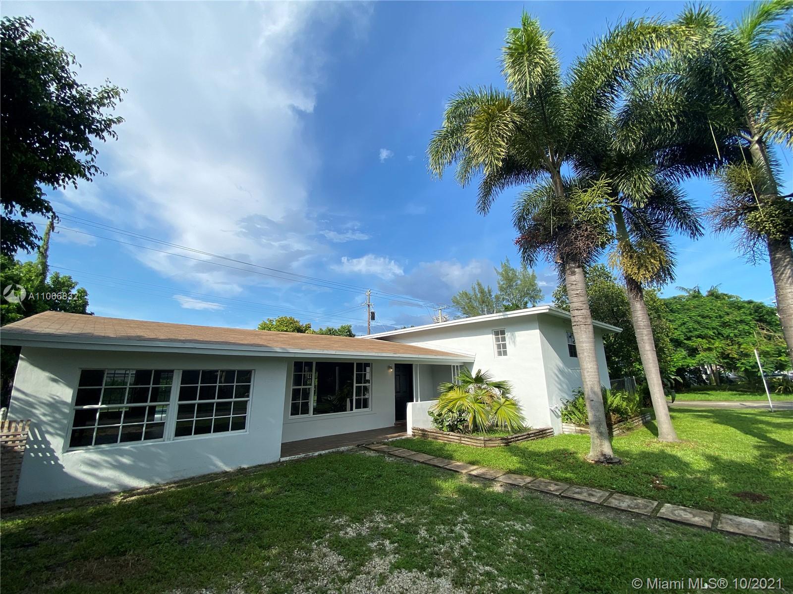 1275 Northeast 204th Terrace Miami, FL 33179 - Photo 48 of 49 a front view of house with a garden