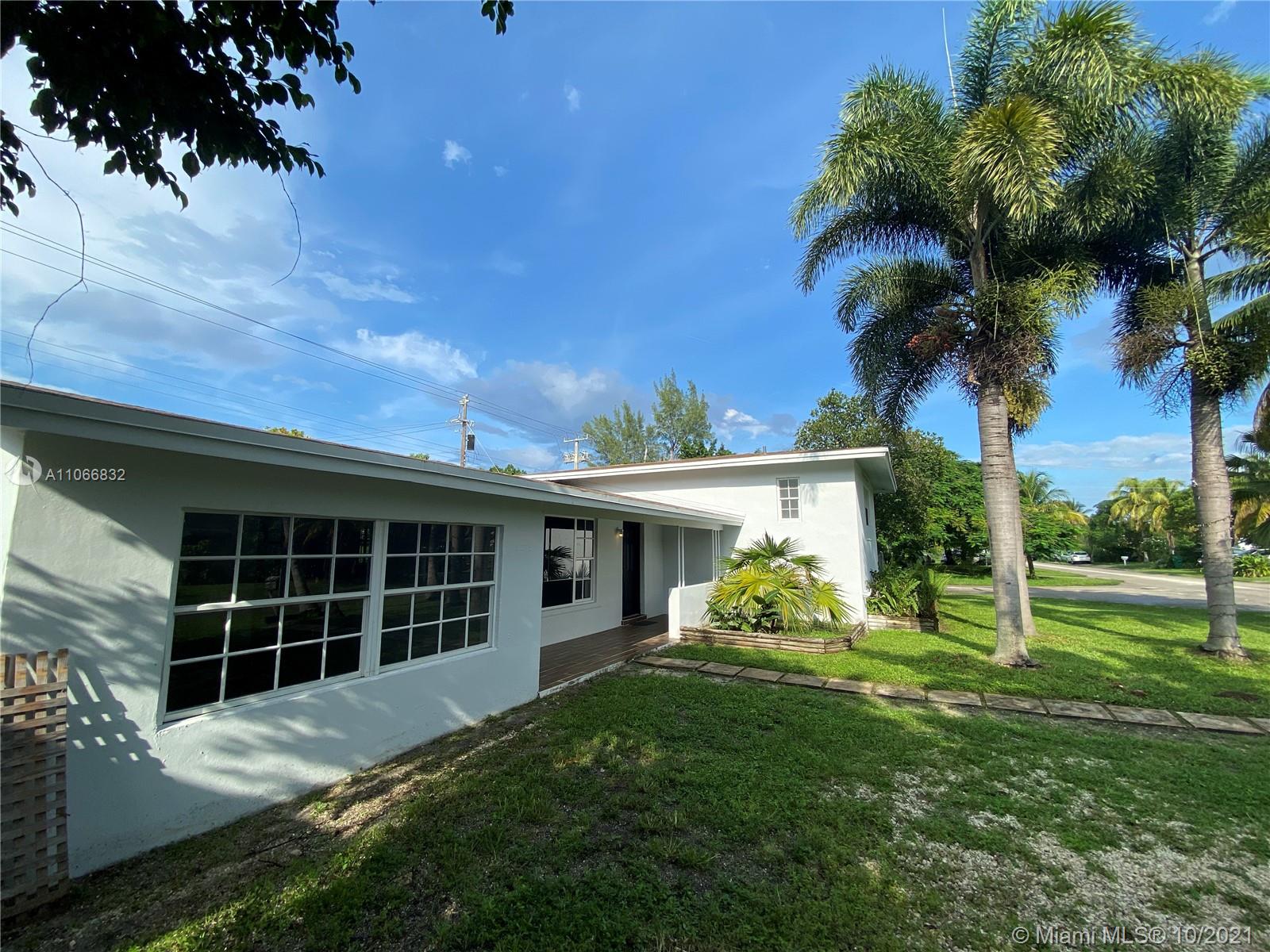 1275 Northeast 204th Terrace Miami, FL 33179 - Photo 49 of 49 a front view of a house with garden