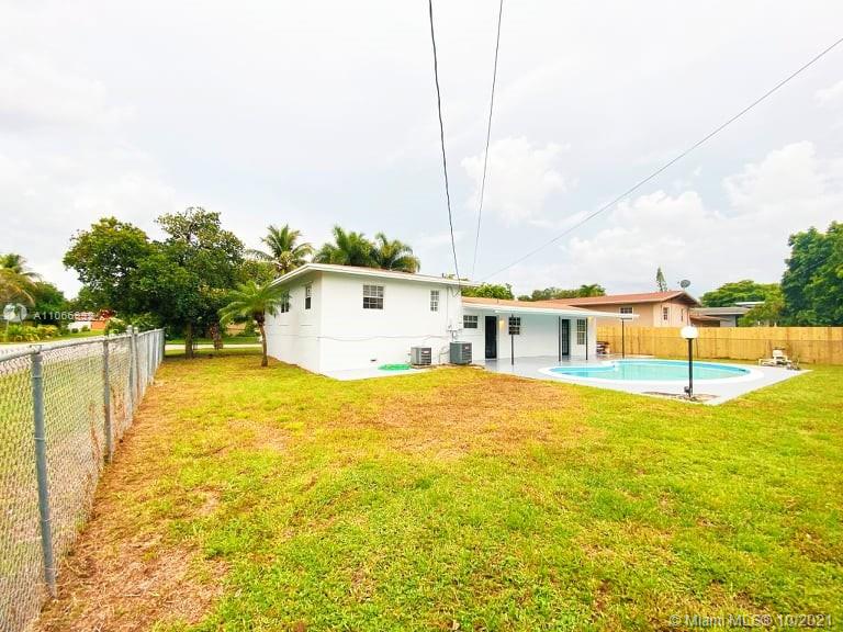 1275 Northeast 204th Terrace Miami, FL 33179 - Photo 10 of 49 a view of a swimming pool with an ocean view