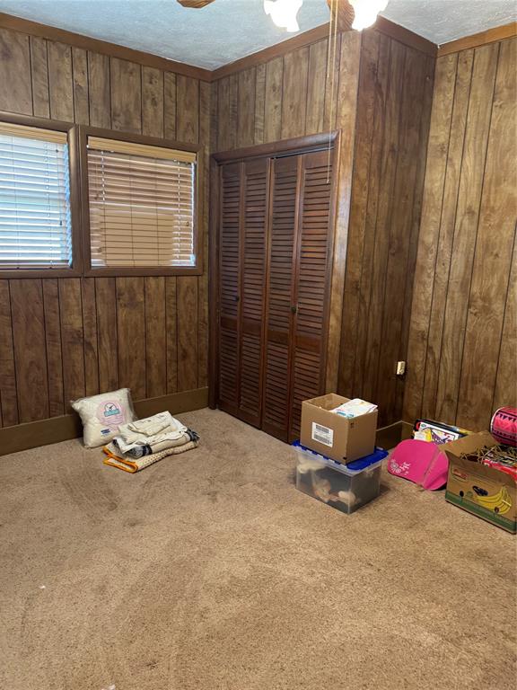 303 East 8th Street Quanah, TX 79252 - Photo 12 of 21 a bedroom with a bed and a window