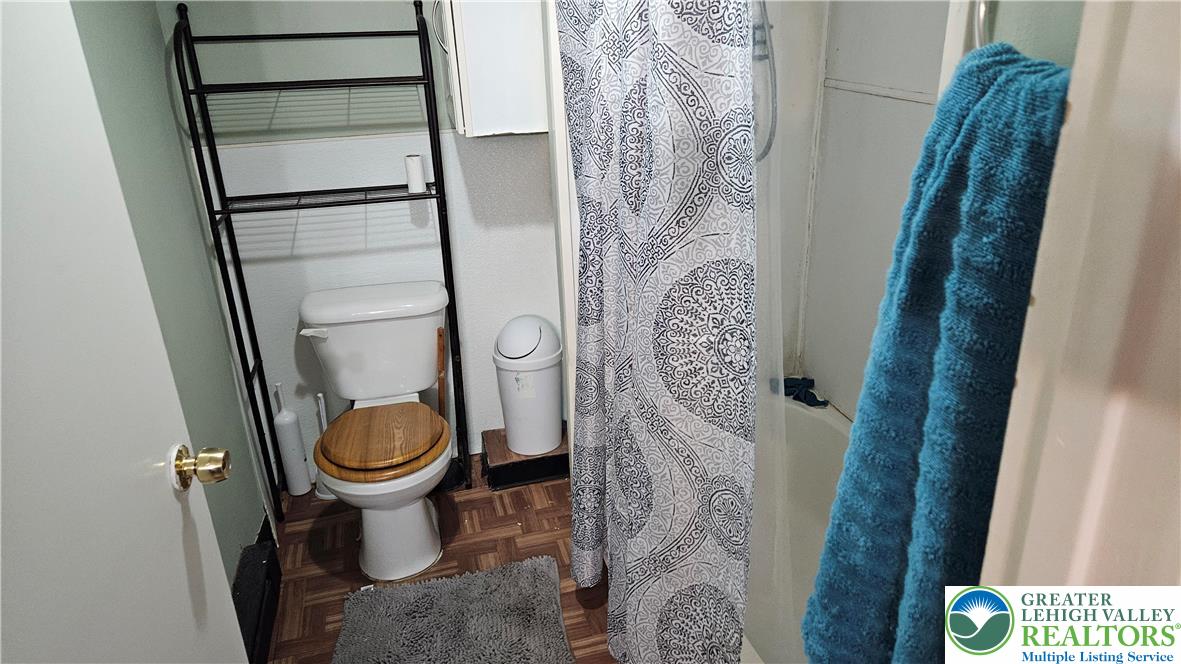 504 Tilghman Street Allentown, PA 18102 - Photo 16 of 33 a bathroom with a toilet and a shower