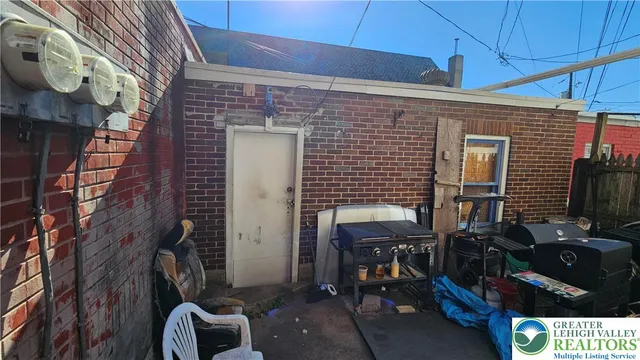 a view of path along with brick wall