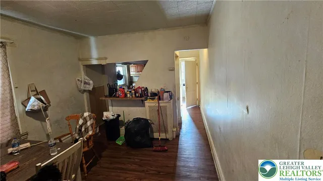 a kitchen with stainless steel appliances granite countertop a refrigerator and a stove