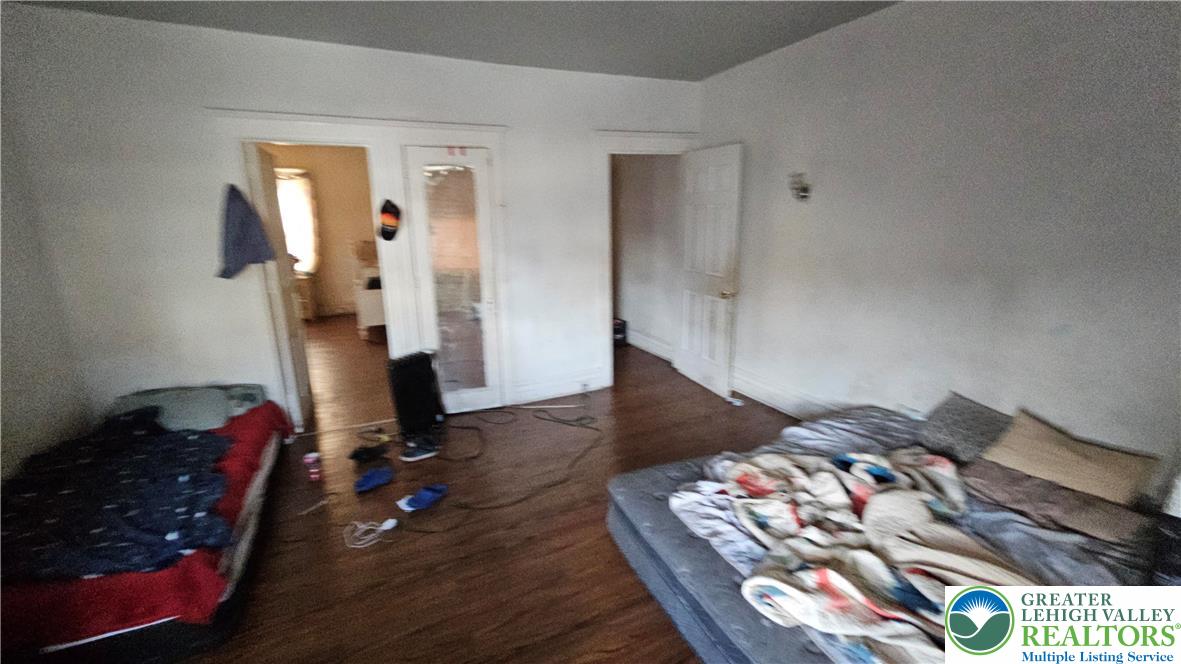 504 Tilghman Street Allentown, PA 18102 - Photo 26 of 33 a view of a bedroom with wooden floor