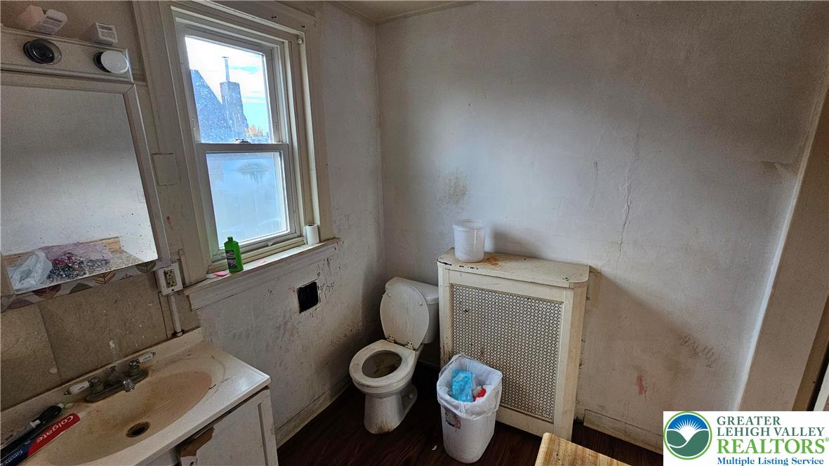 504 Tilghman Street Allentown, PA 18102 - Photo 33 of 33 a bathroom with a toilet and a sink