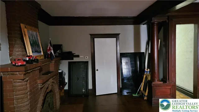 a living room with furniture and flat screen tv