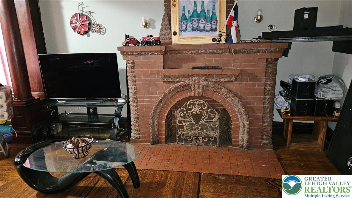 504 Tilghman Street Allentown, PA 18102 - Photo 8 of 33 a living room with furniture and flat screen tv