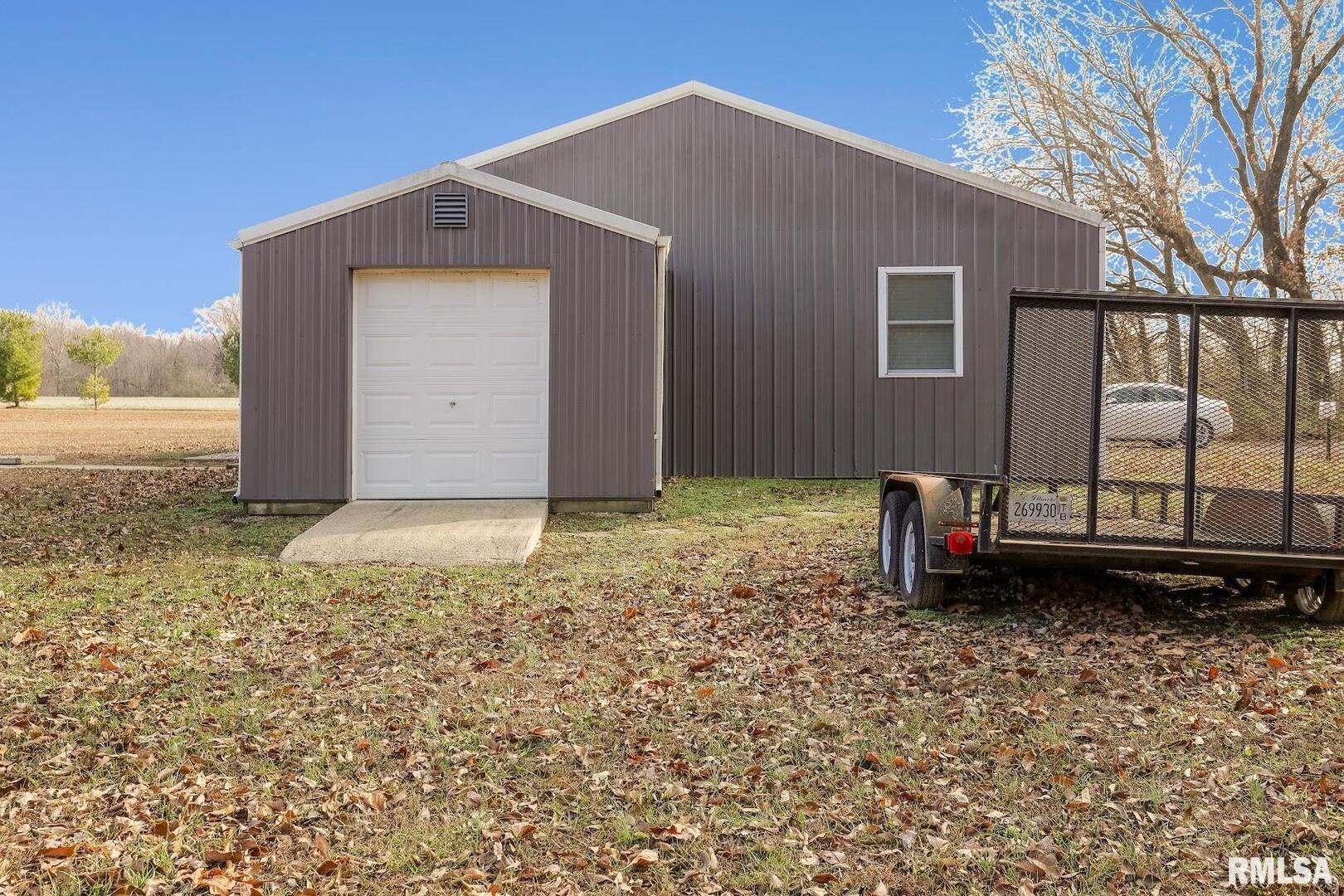 0 Bolen Store Road Thompsonville, IL 62890 - Photo 7 of 52 a front view of a house with garden