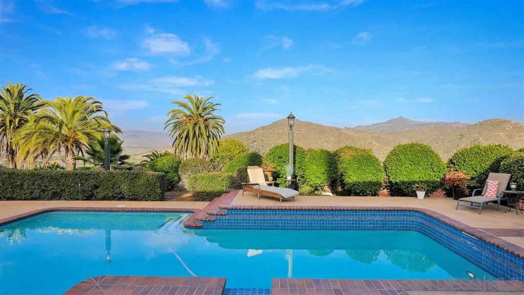2723 Rich Lynn Ridge Road Escondido, CA 92025 - Photo 17 of 24 a swimming pool with outdoor seating and yard
