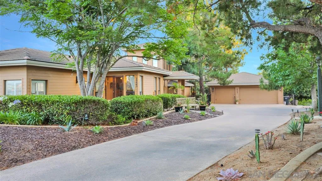 2723 Rich Lynn Ridge Road Escondido, CA 92025 - Photo 6 of 24 a front view of a house with a yard and a garage
