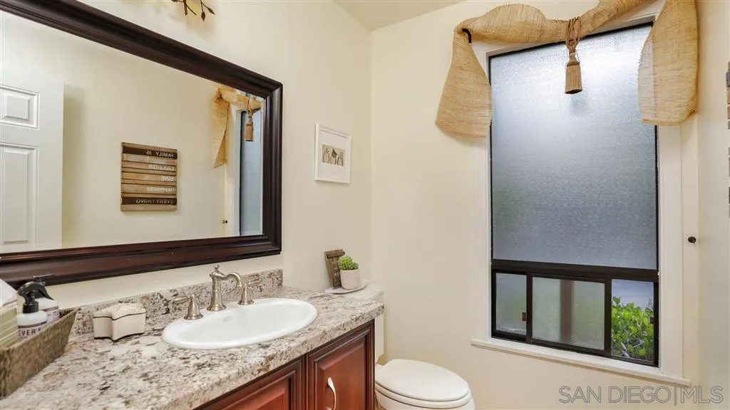 2723 Rich Lynn Ridge Road Escondido, CA 92025 - Photo 10 of 24 a bathroom with a granite countertop sink toilet and shower