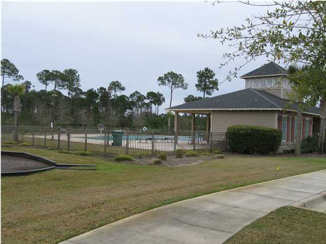 408 Pin Oak Loop Santa Rosa Beach, FL 32459 - Photo 11 of 14 a front view of a house with a yard