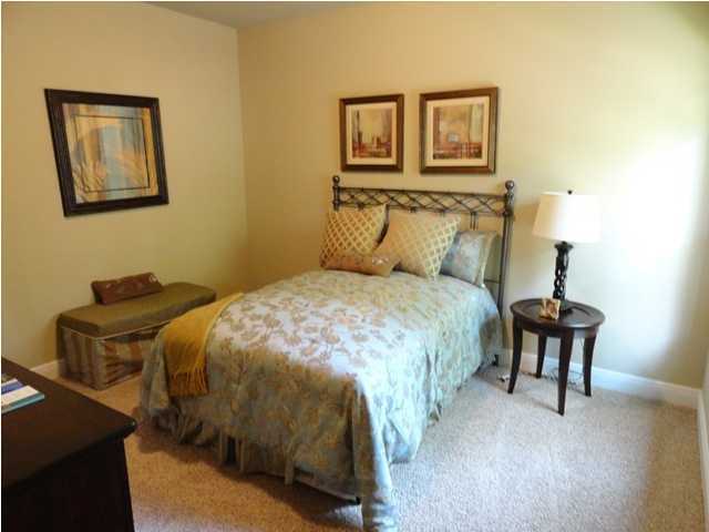 408 Pin Oak Loop Santa Rosa Beach, FL 32459 - Photo 10 of 14 a bedroom with a bed and wooden floor