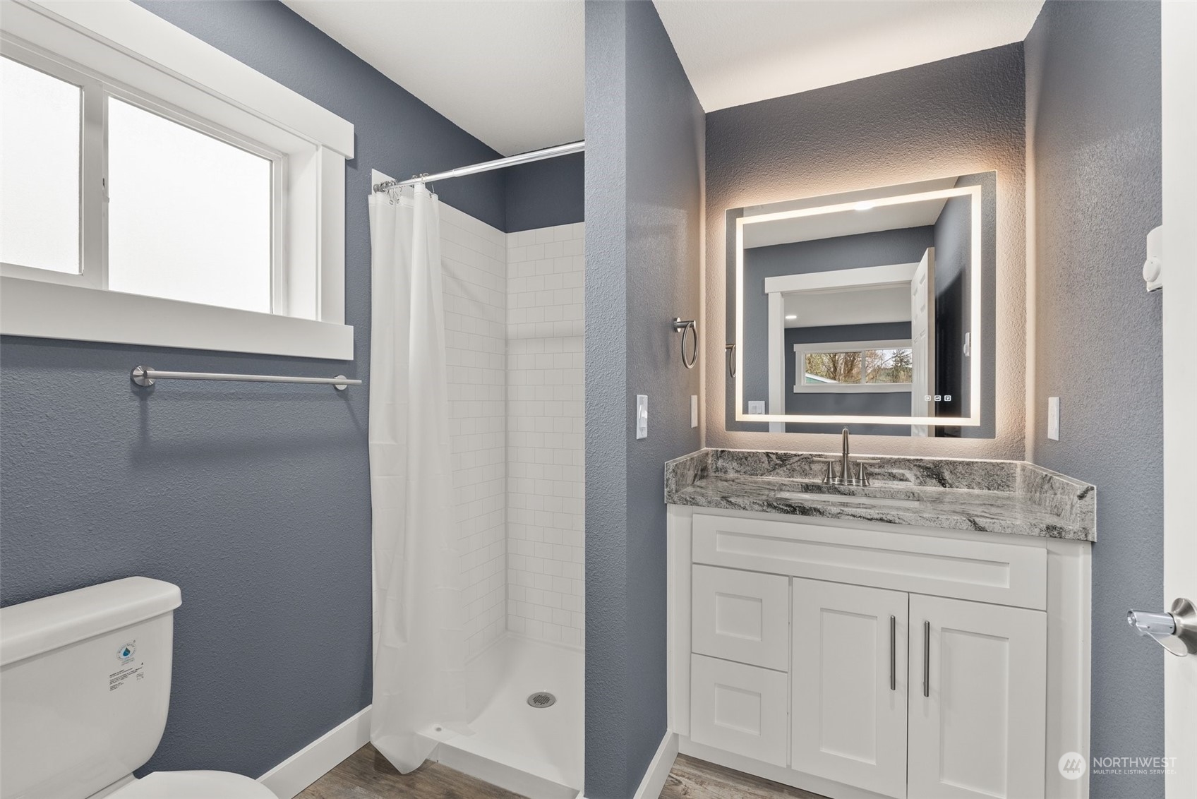 916 Boistfort Road Curtis, WA 98538 - Photo 26 of 36 a bathroom with a granite countertop sink toilet and shower