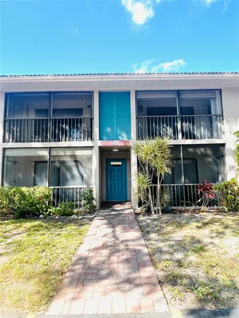 a view of house with outdoor space and porch