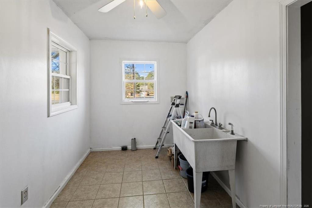 912 Main Street Raeford, NC 28376 - Photo 11 of 36 a bathroom with a sink and a window