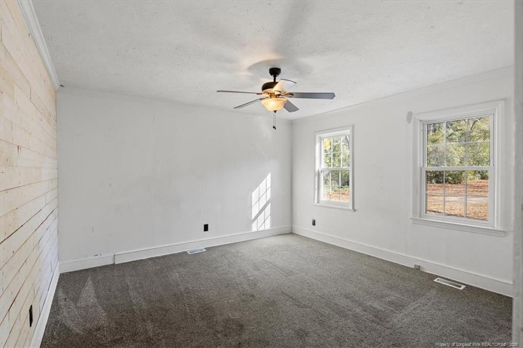 912 Main Street Raeford, NC 28376 - Photo 12 of 36 a view of an empty room with a window