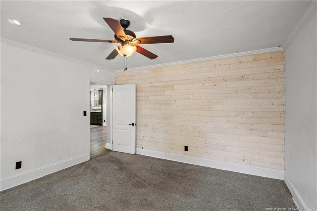 912 Main Street Raeford, NC 28376 - Photo 13 of 36 an empty room with closet and ceiling fan