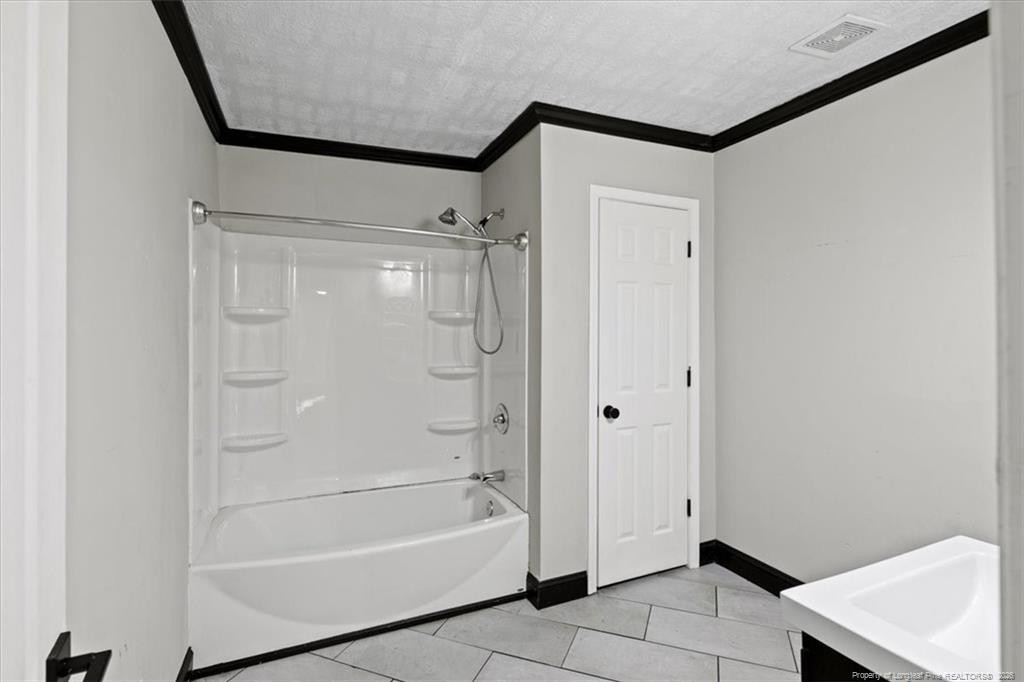 912 Main Street Raeford, NC 28376 - Photo 17 of 36 a bathroom with a bathtub