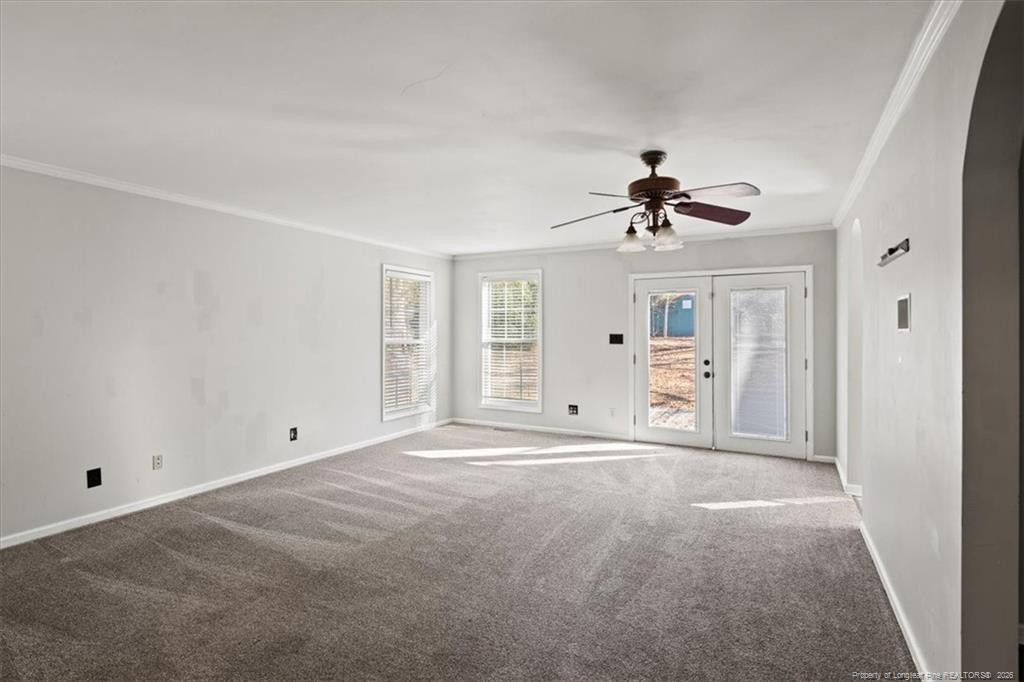 912 Main Street Raeford, NC 28376 - Photo 18 of 36 a view of an empty room with a ceiling fan and window