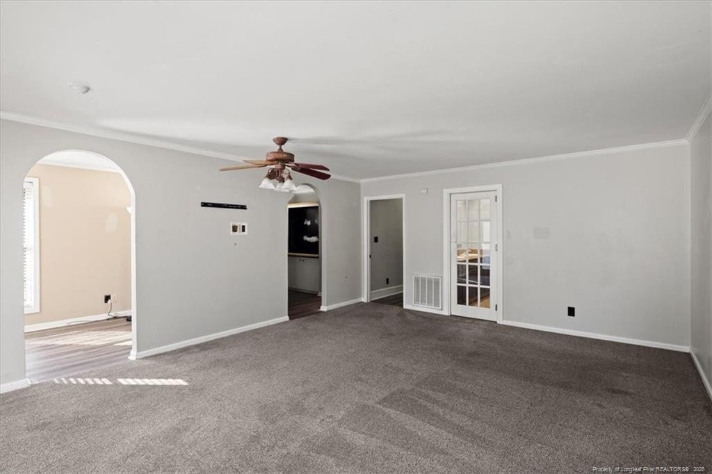 912 Main Street Raeford, NC 28376 - Photo 19 of 36 an empty room with chandelier fan