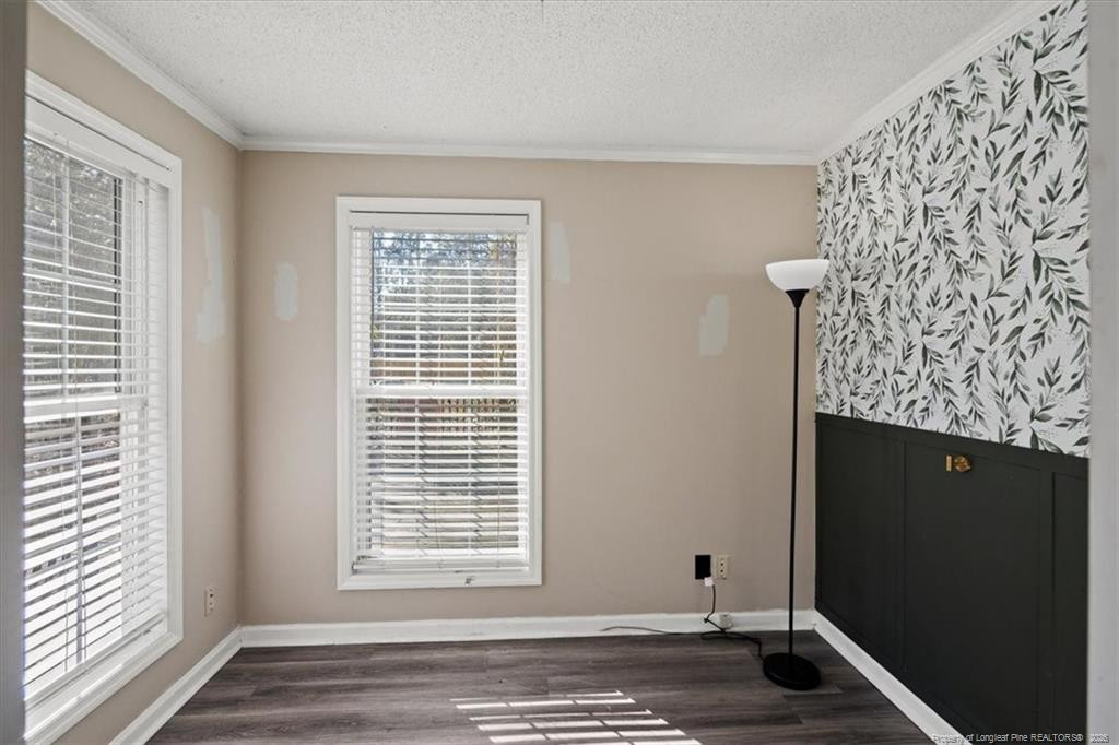 912 Main Street Raeford, NC 28376 - Photo 20 of 36 a view of an empty room with a window and wooden floor