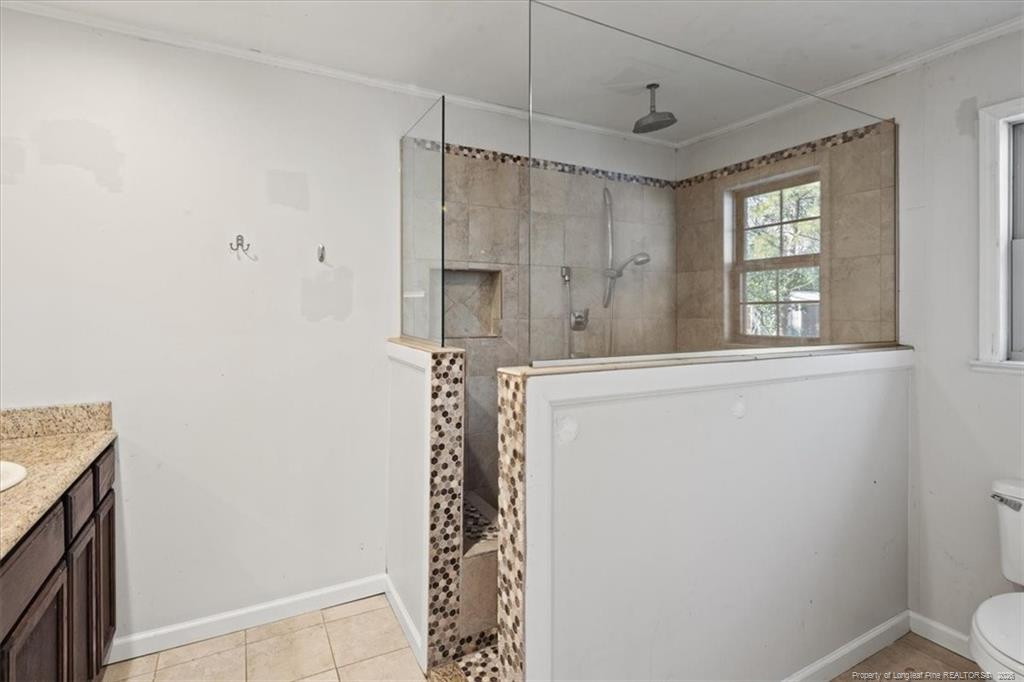 912 Main Street Raeford, NC 28376 - Photo 23 of 36 a bathroom with a shower and a sink
