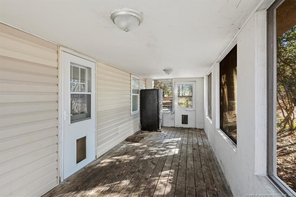 912 Main Street Raeford, NC 28376 - Photo 26 of 36 a view of a hallway with wooden shelves