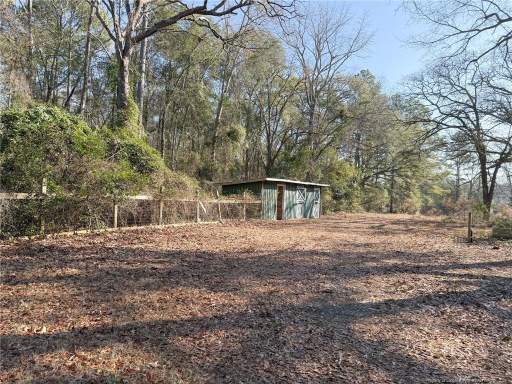 912 Main Street Raeford, NC 28376 - Photo 29 of 36 a view of a house with large trees