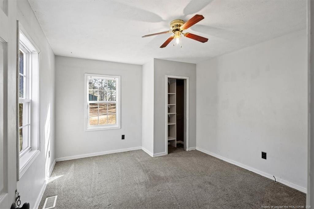 912 Main Street Raeford, NC 28376 - Photo 6 of 36 wooden floor in an empty room with a window