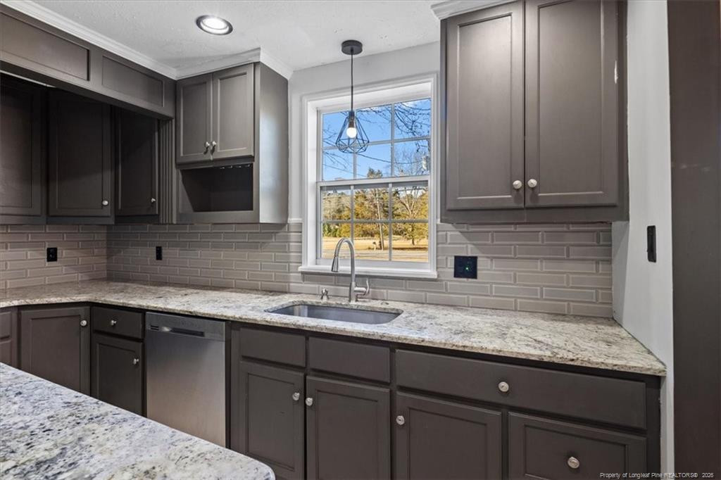 912 Main Street Raeford, NC 28376 - Photo 7 of 36 a kitchen with a sink and a microwave